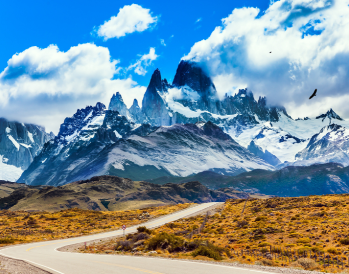 panoramic view of a hihgway in patagonia with big mountains