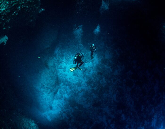 Getty Images Dive into cave in Palau blue hole