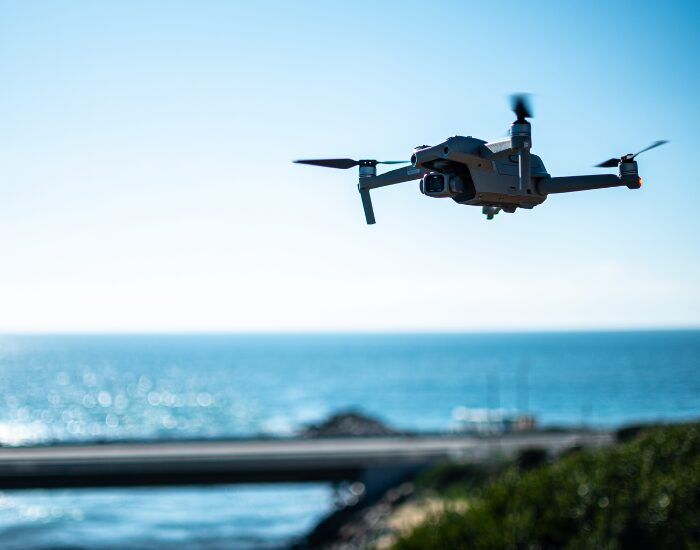  a drone flying close to the ocean