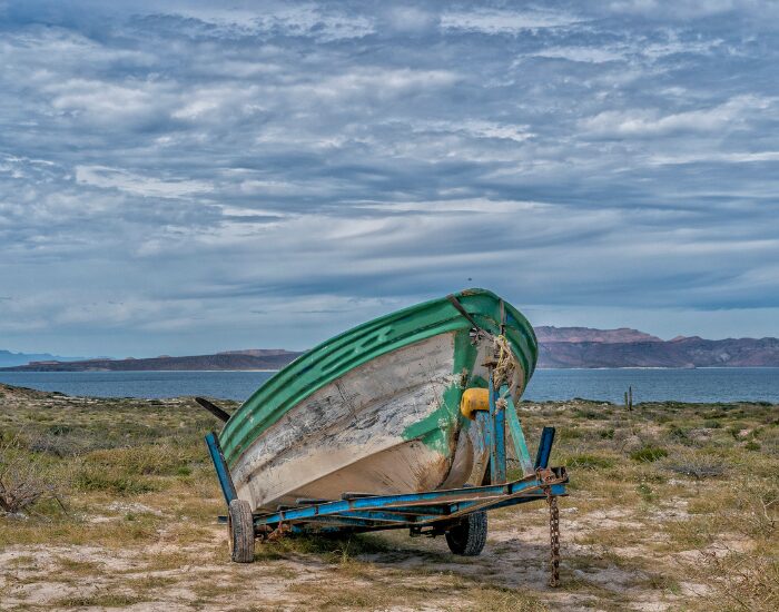 Izanbar old Fisherman boat in the Gulf of California resting on land next to the gulf of calfornia