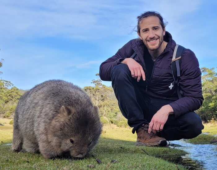 human with wombat on maria island.webp human with wombat on maria island.webp