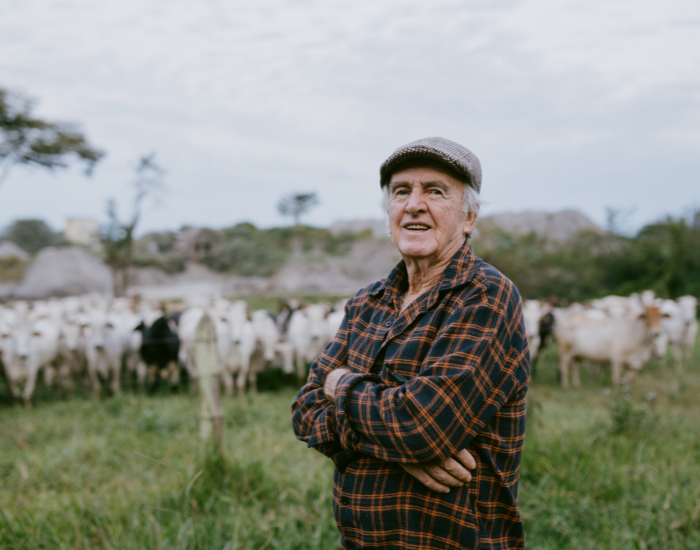 rancher.webp rancher in front of livestock
