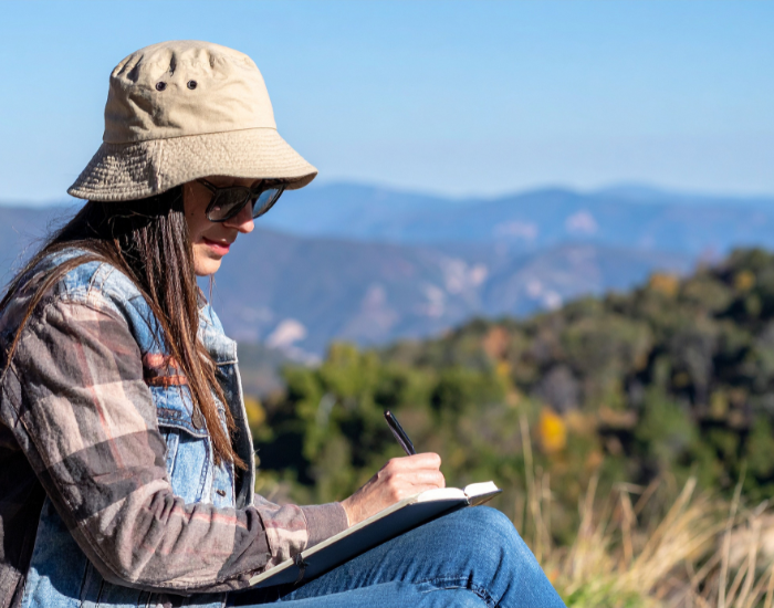 woman-writting.webp woman writting in a notebook