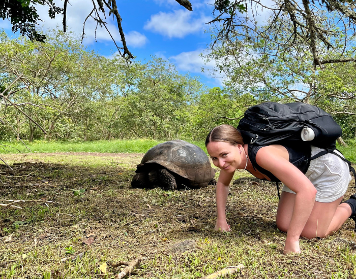 Jaclyn Babbage with a Galápagos tortoise