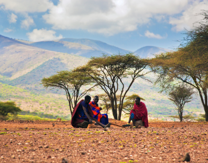 masai-people.webp masai people sitting on the ground with traditional clothing