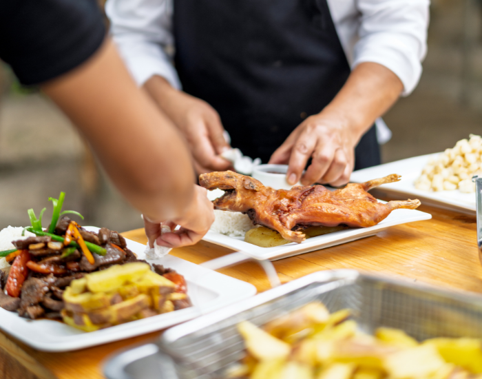 roasted-cuy.webp chef preparing a roasted cuy