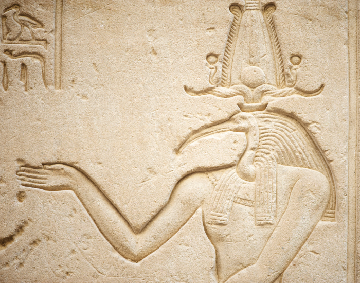 ancient Egypt hieroglyph of toth showing a human body with an ibis head