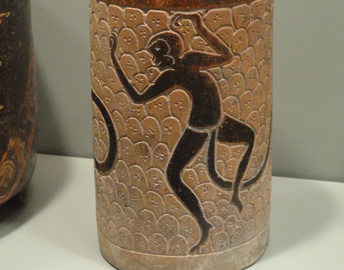 ancient mayan container with the image of a spider monkey