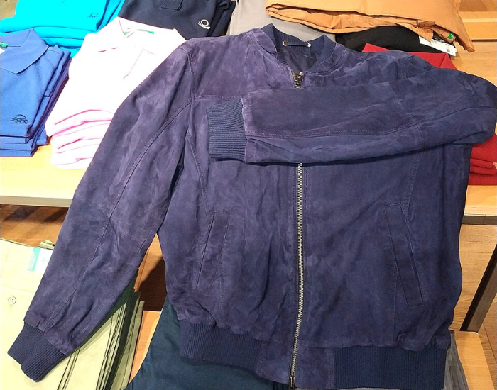 a blue Chamois leather jacket displayed in a retail store