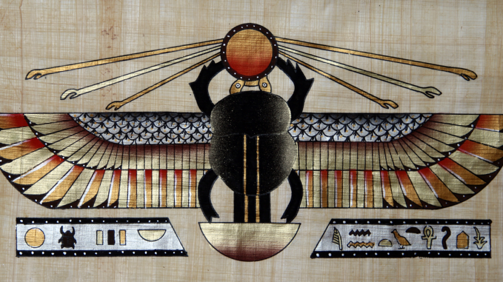 a payrus showing the image of a sacred Scarab Beetle painted