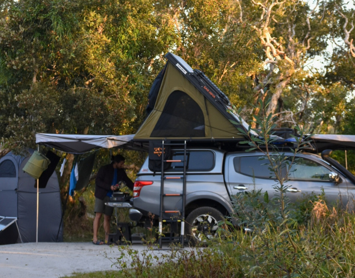 4WD setup with rooftop tent parked at a Red Cliff camping spot.