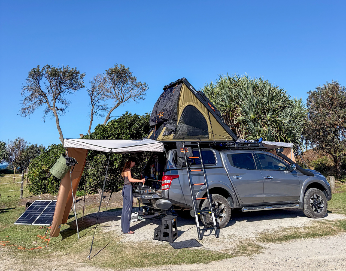 4WD vehicle with an open roof tent set up at Red Cliff campground.