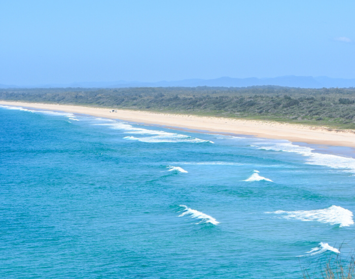 panoramic view of a blue beach at point plomer